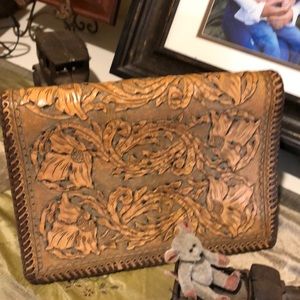 Hand tooled leather book or Bible cover.